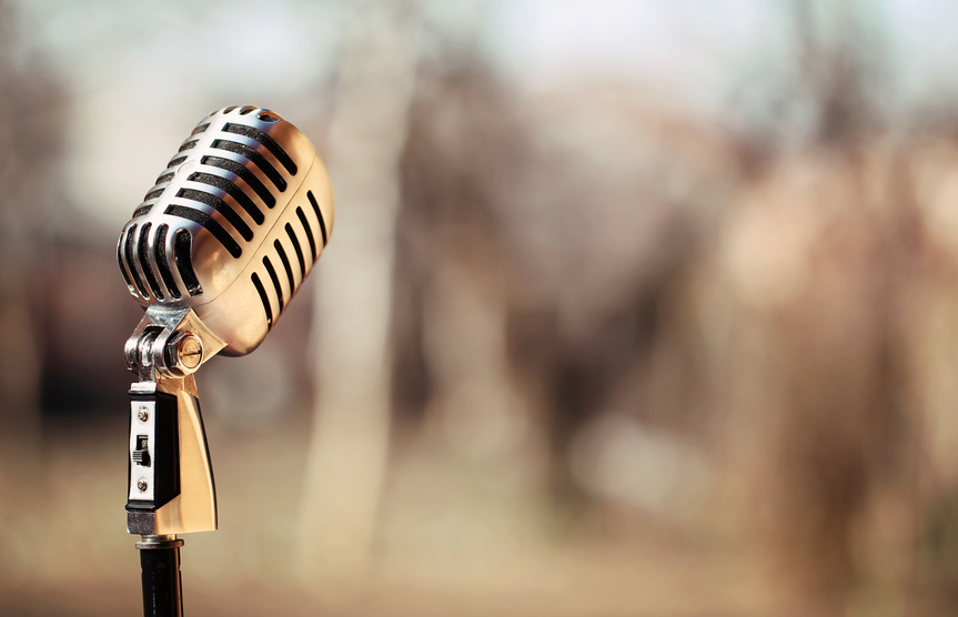 Silver vintage microphone in the studio on blured background