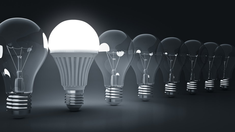 Glowing LED bulb and simple light bulbs. 3d rendering