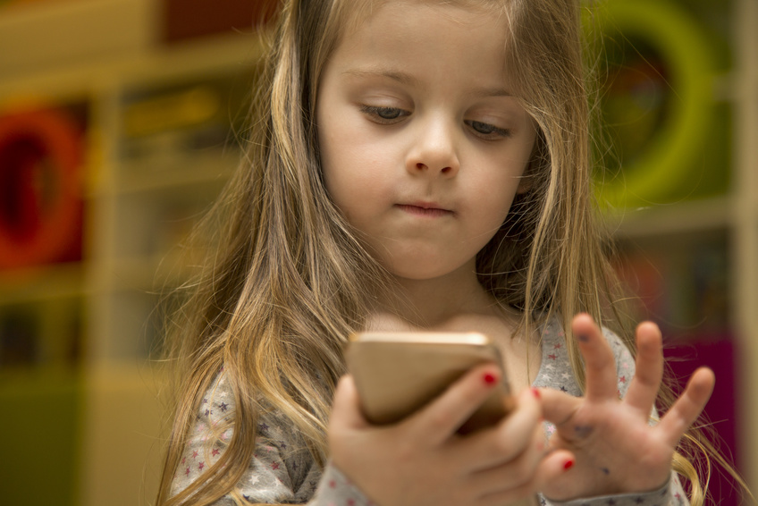 Little girl with mobile phone